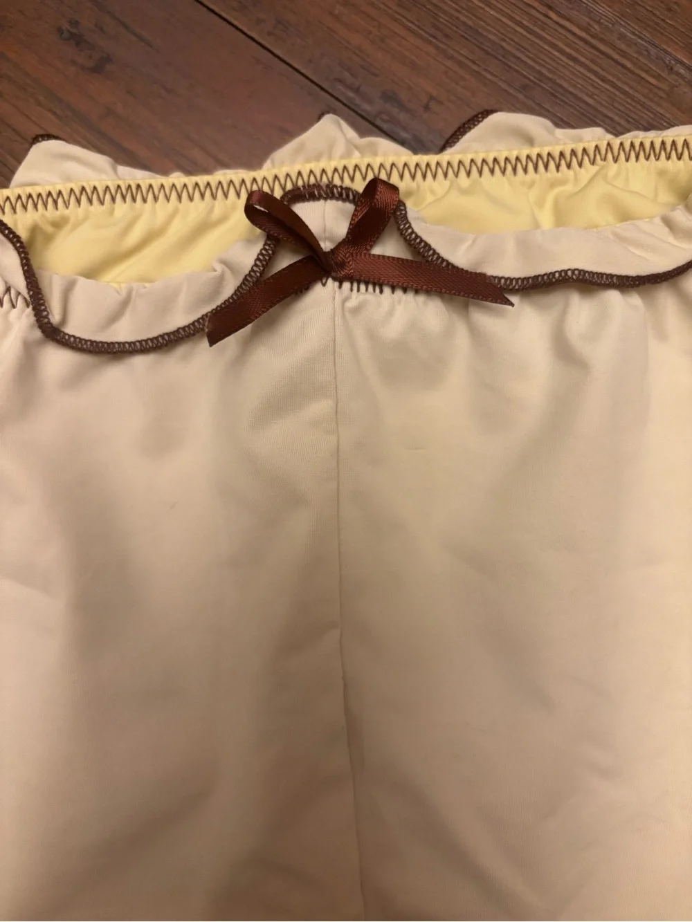 Frankie’s bikinis x Gigi HADID yellow swim shorts with brown trim